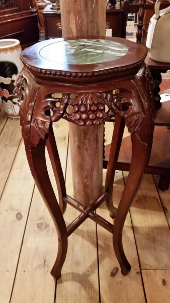 Oriental style hardwood stand with marble insert beautifully carved apron  depicting fruit and foliage with elegant carved legs $150.00