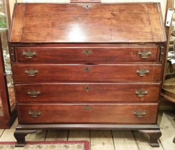 18th Century mahogany Chippendale slant top desk with ogee bracket base, Loper writing lid supports, a full interior of drawers including three hidden drawers, cubbies & a private door. Wear consistent with age and use.